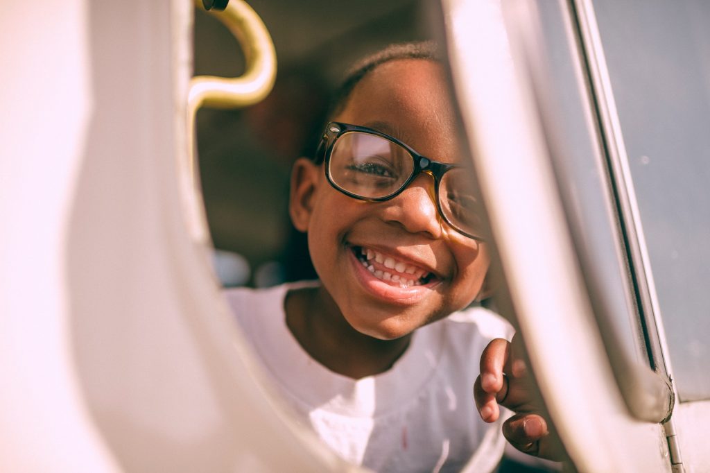 a kid playing on a playground structure